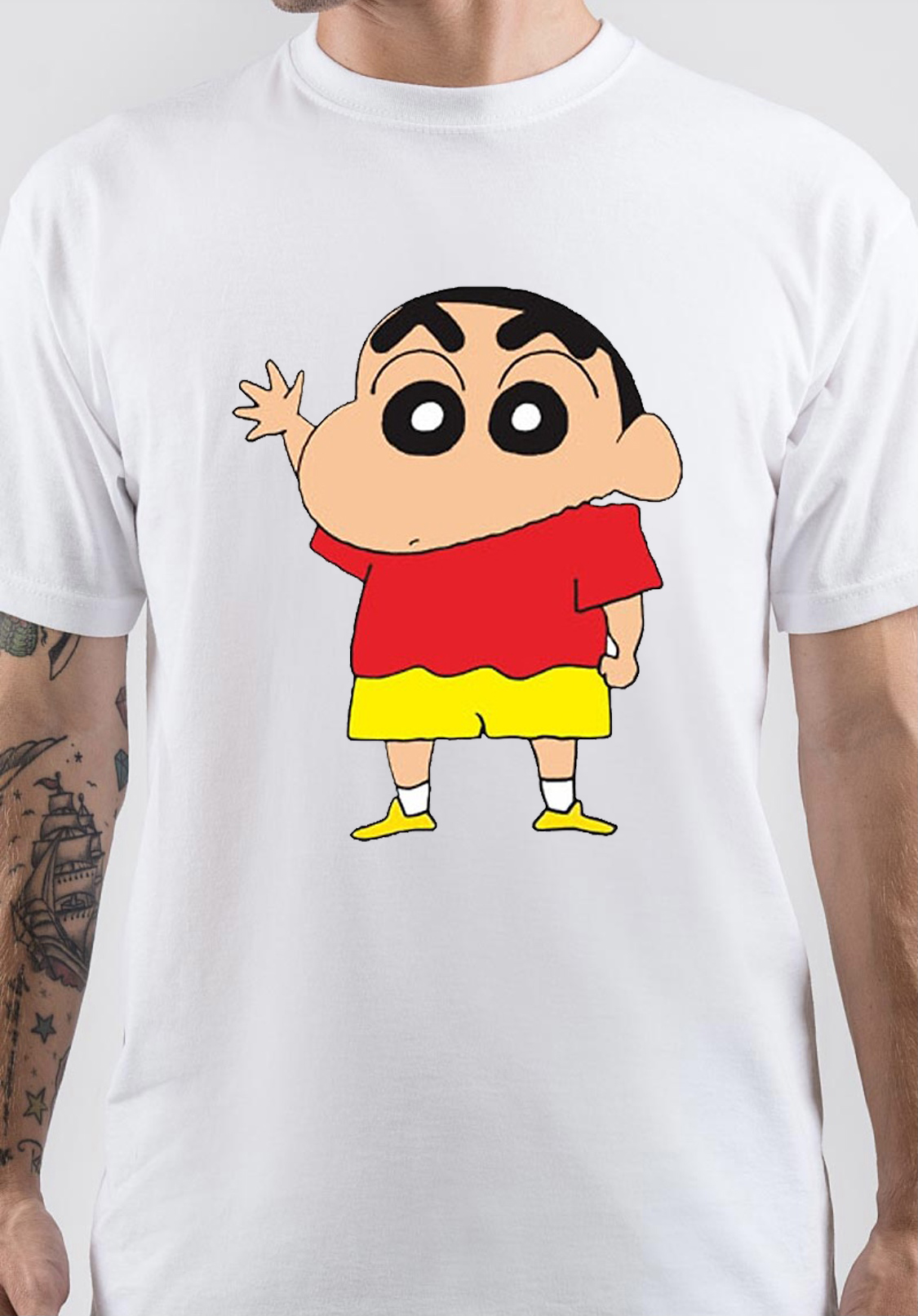 Shin-chan tattoo located on the bicep, cartoon style.